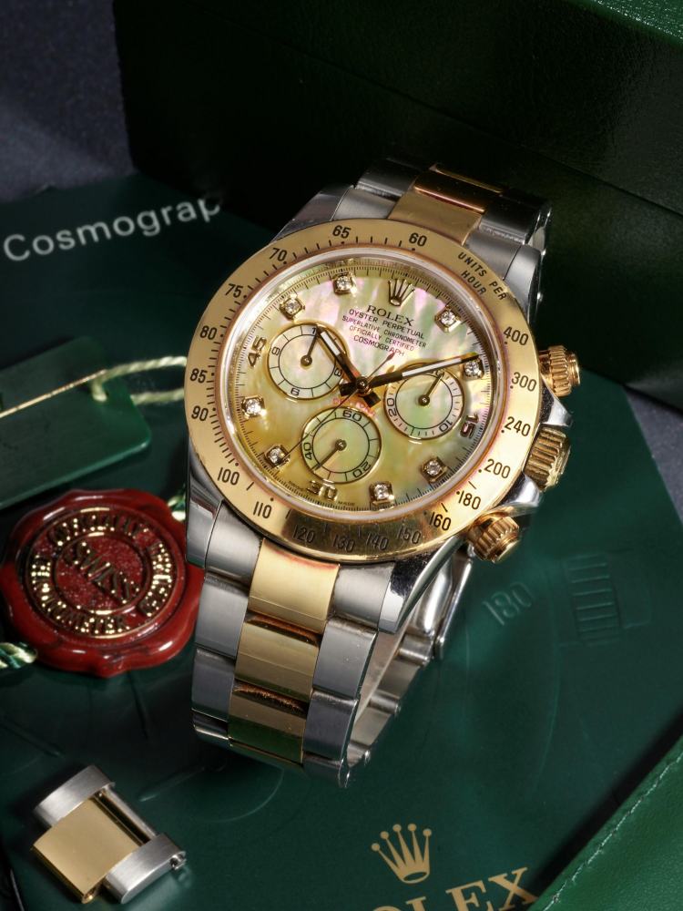ROLEX | COSMOGRAPH DAYTONA, REF.116523, A RARE YELLOW GOLD AND STAINLESS STEEL CHRONOGRAPH BRACELET WATCH WITH YELLOW MOTHER-OF-PEARL DIAL AND DIAMOND-SET HOUR MARKERS, CIRCA 2011