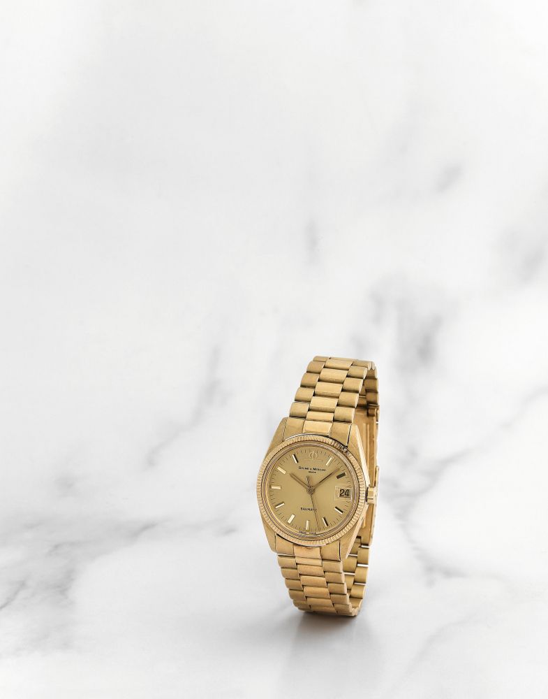 Baume & Mercier. Montre bracelet en or jaune 18K (750) avec date mouvement automatique