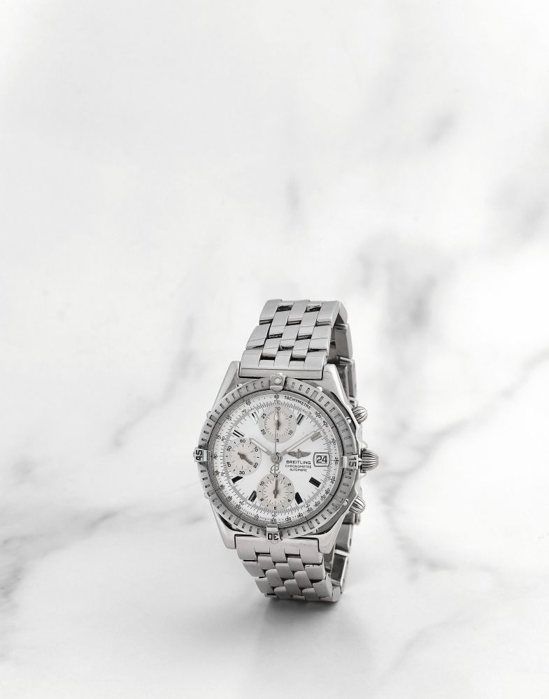 Breitling. Chronographe bracelet en acier avec date mouvement automatique