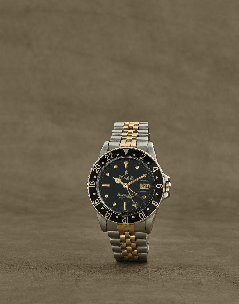 Rolex. Montre bracelet en or jaune 18K (750) et acier avec date et 2nd fuseau horaire mouvement automatique
