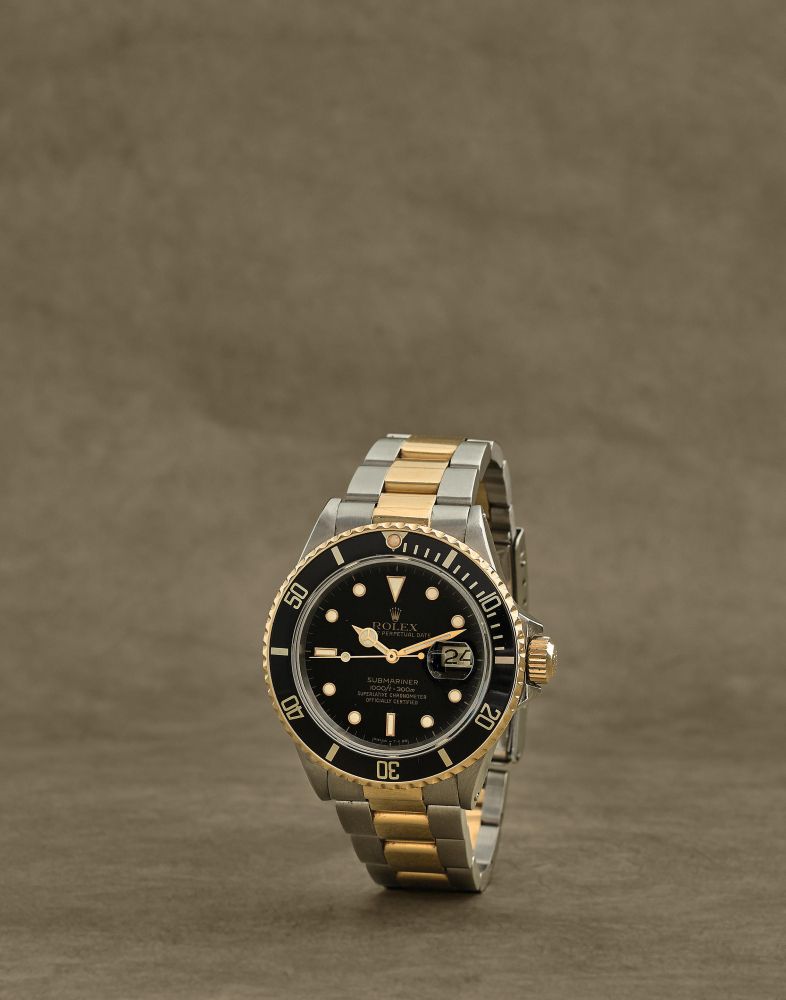 Rolex. Montre bracelet en or jaune 18K (750) et acier avec date mouvement automatique