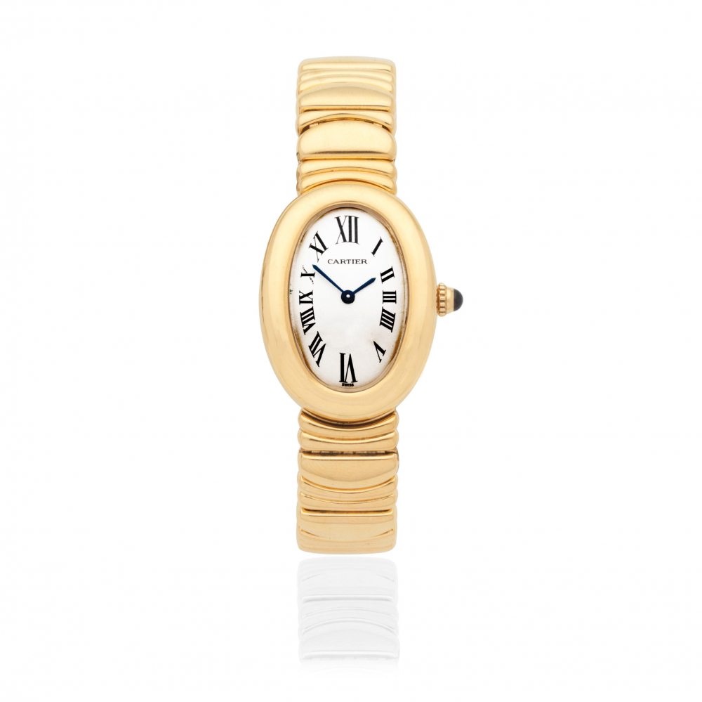 Cartier. A lady's 18K gold quartz bracelet watch