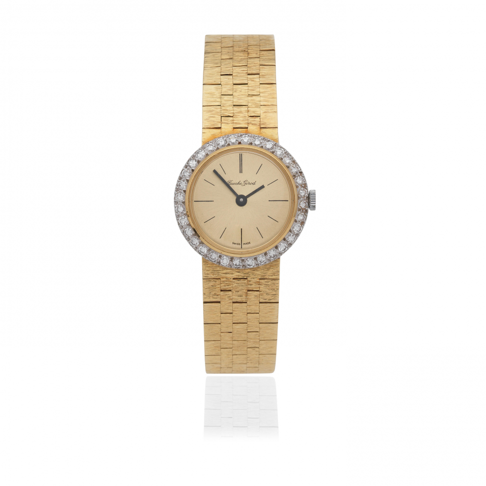 Bueche Girod. A lady's 18K gold diamond set manual wind bracelet watch