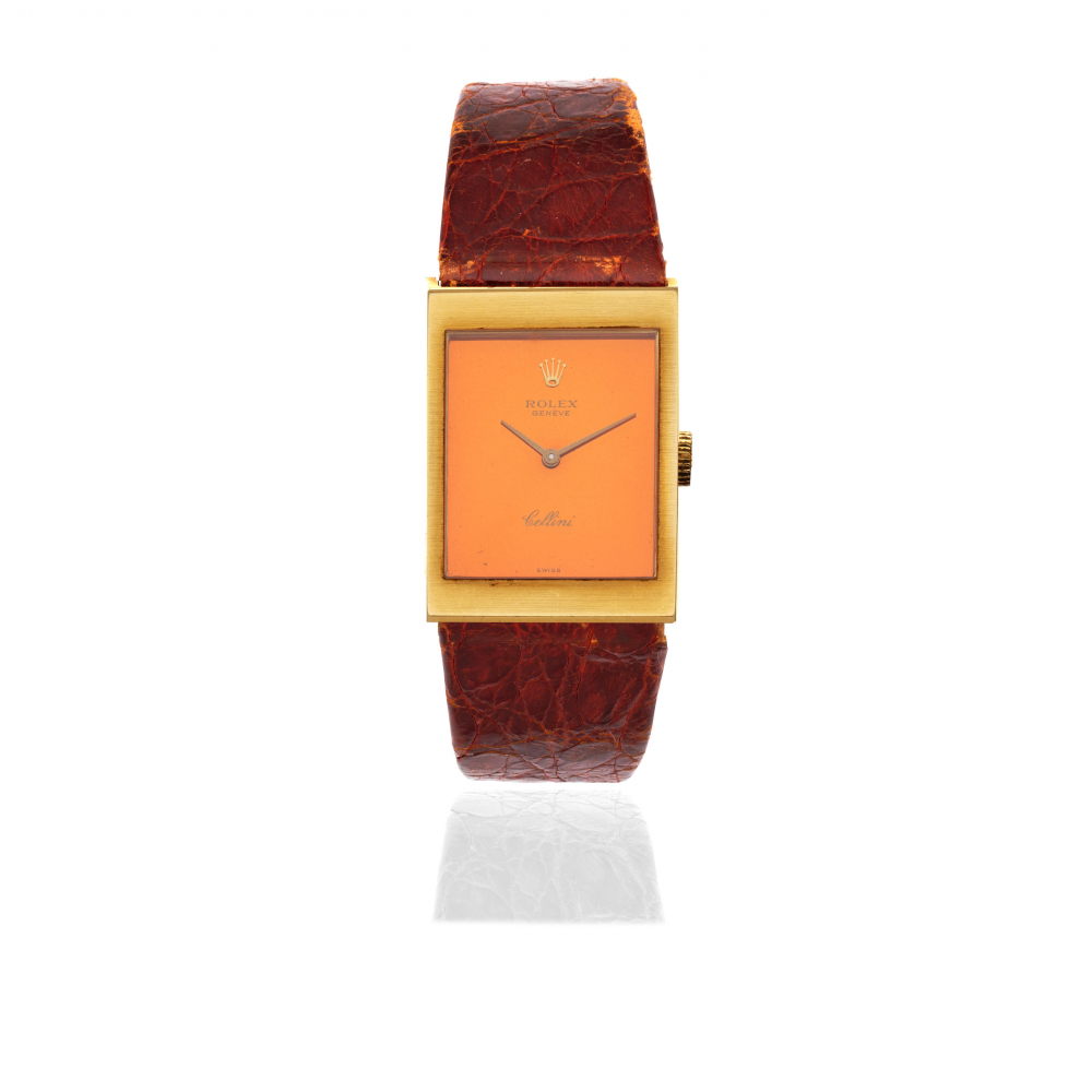 Rolex. An 18K gold manual wind rectangular wristwatch with mirrored dial