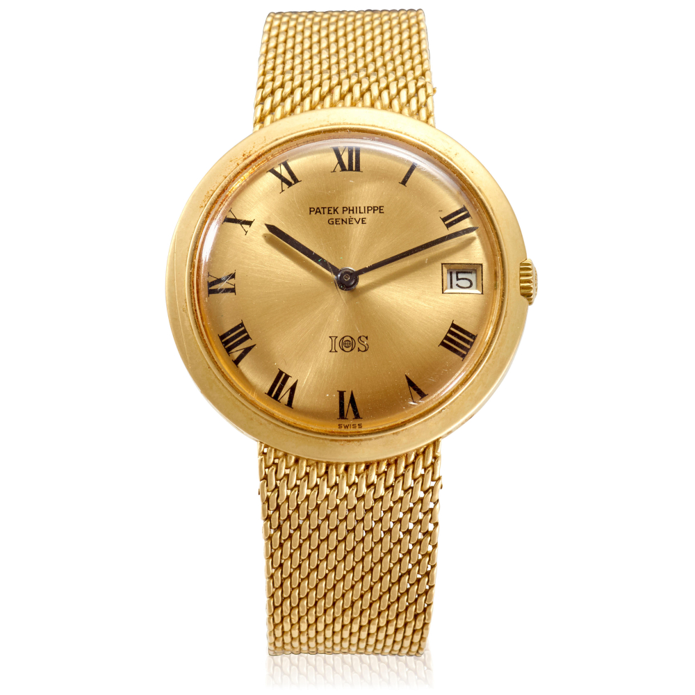 PATEK PHILIPPE. AN 18K GOLD SPECIAL ORDER AUTOMATIC CALENDAR BRACELET WATCH