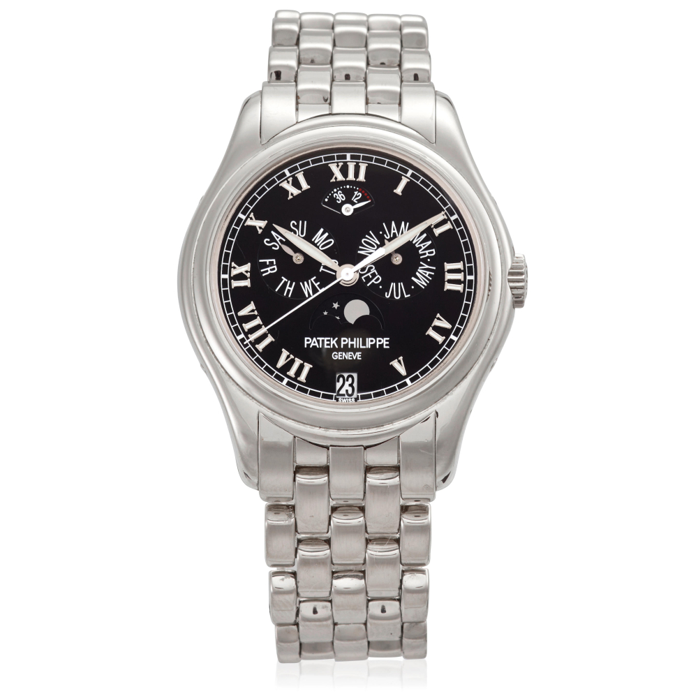 PATEK PHILIPPE. AN 18K WHITE GOLD AUTOMATIC TRIPLE CALENDAR BRACELET WATCH WITH MOON PHASE AND POWER RESERVE INDICATION