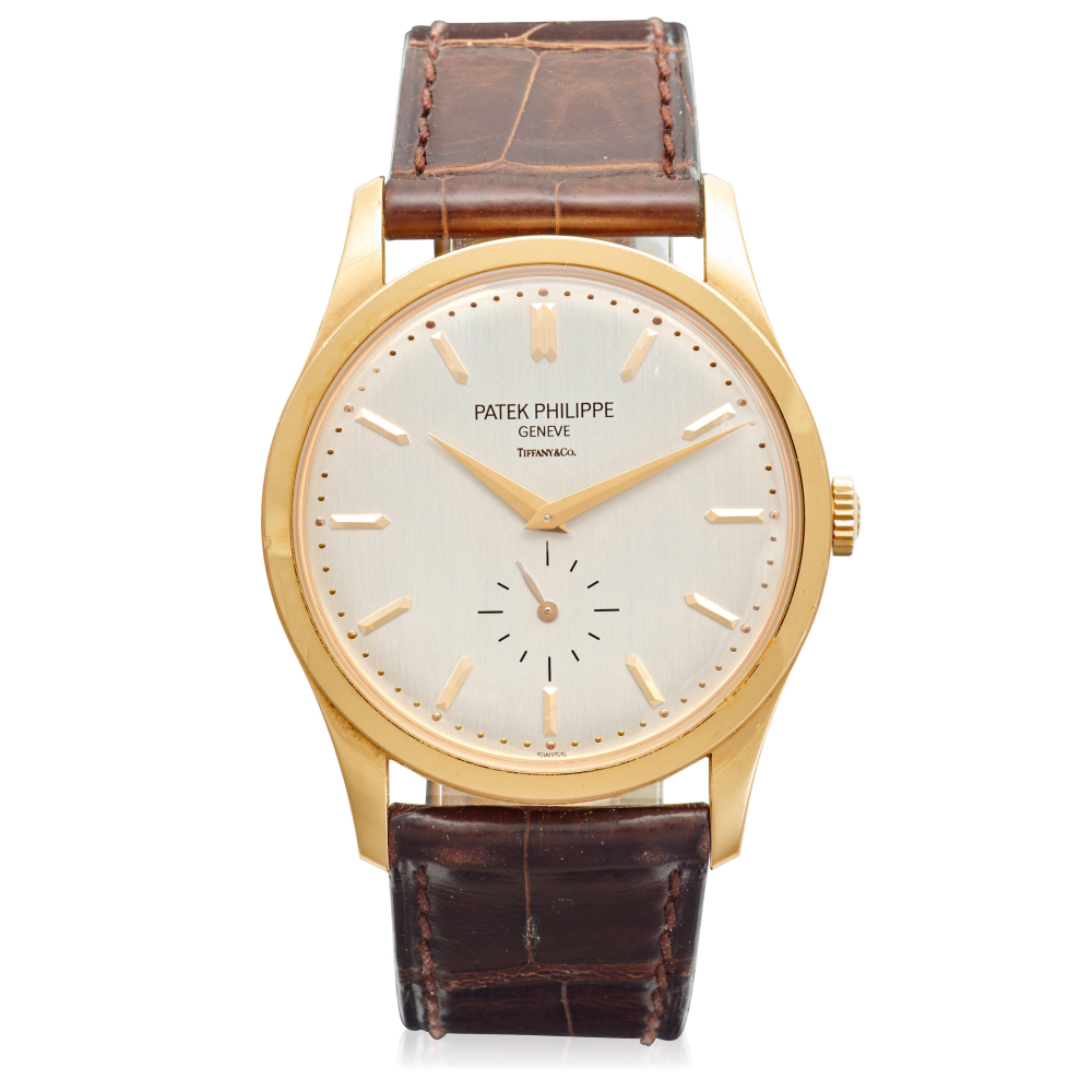 PATEK PHILIPPE. AN 18K GOLD MANUAL WIND WRISTWATCH SIGNED BY TIFFANY & CO.