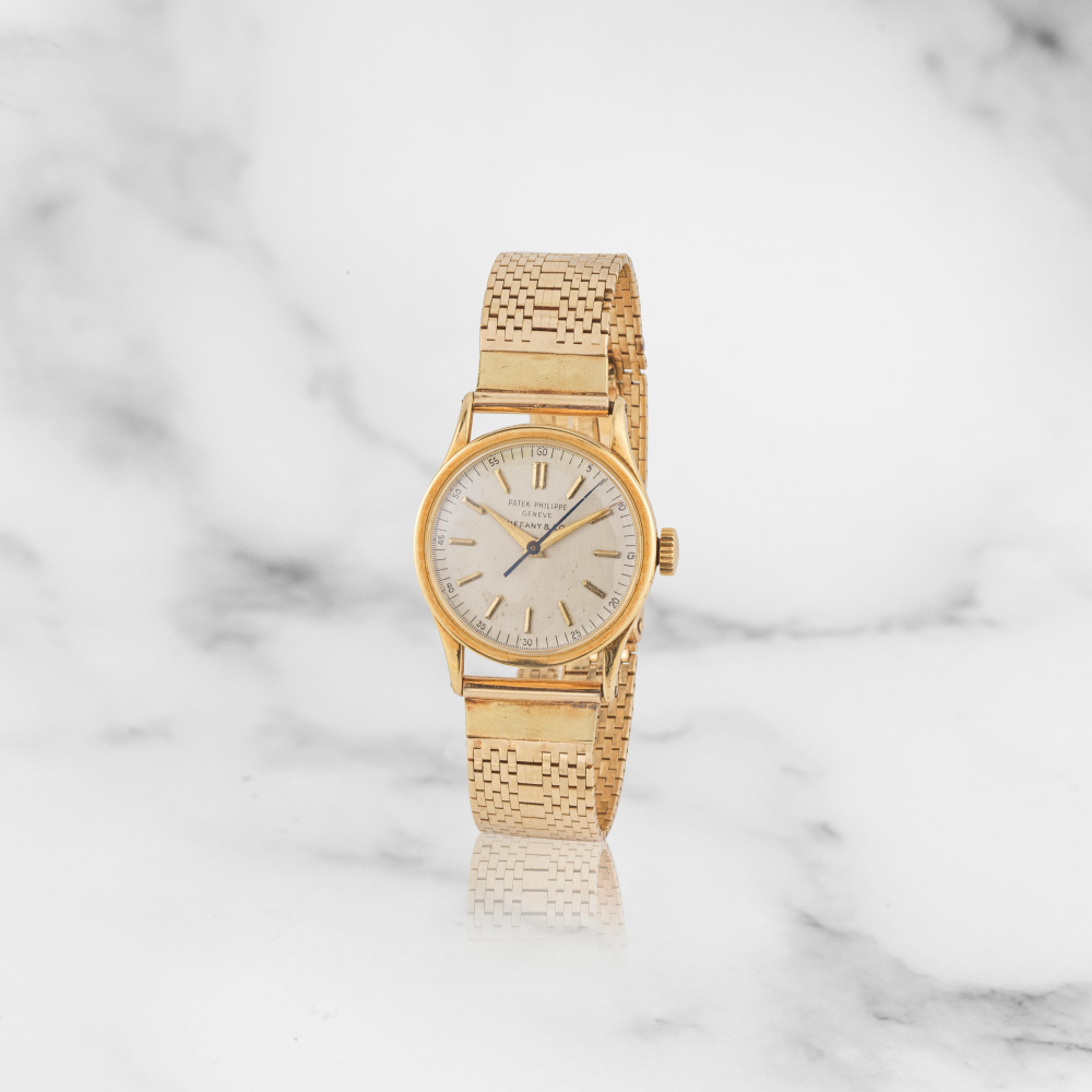 Patek Philippe. Montre bracelet en or jaune 18K (750) distribuée par Tiffany & Co. mouvement mécanique
