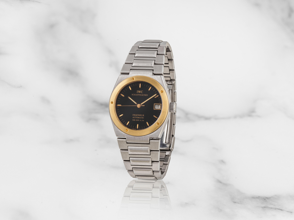 IWC. Montre bracelet en or jaune 18K (750) et acier avec date mouvement automatique