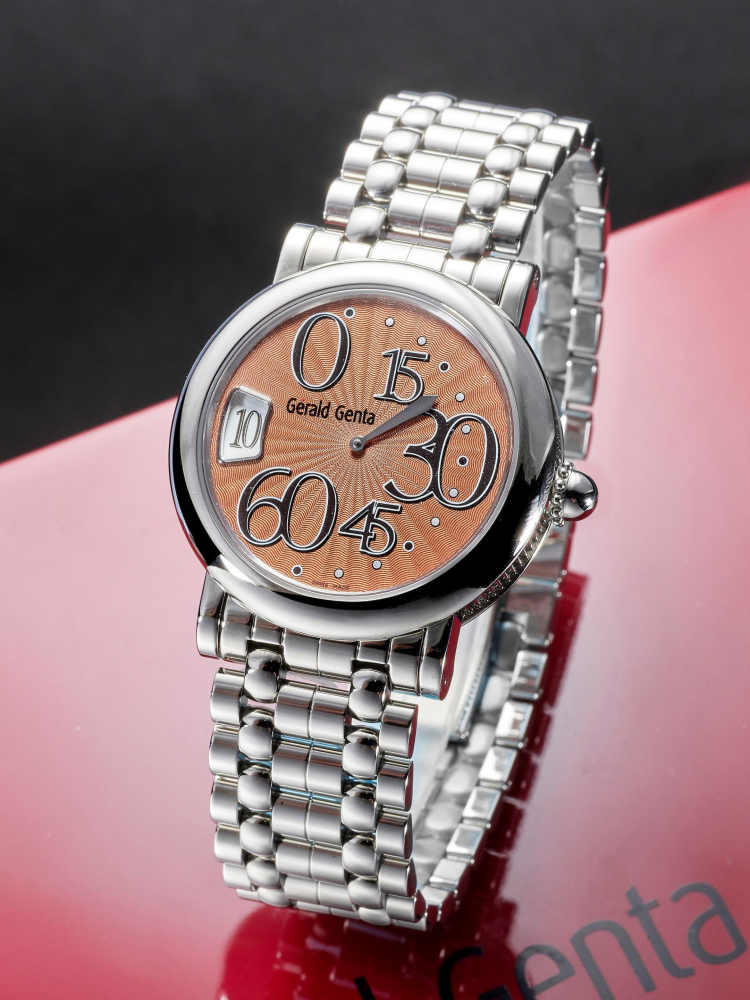 GÉRALD GENTA | RETRO CLASSIC, A NEW OLD STOCK STAINLESS STEEL BRACELET WATCH WITH RETROGRADE MINUTES, JUMPING HOUR AND SALMON DIAL, CIRCA 2005