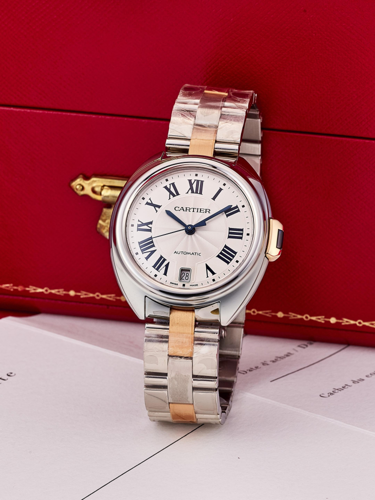 CARTIER | CLÉ DE CARTIER, REF.W2CL0003, A NEW OLD STOCK STAINLESS STEEL AND PINK GOLD BRACELET WATCH WITH DATE, CIRCA 2015