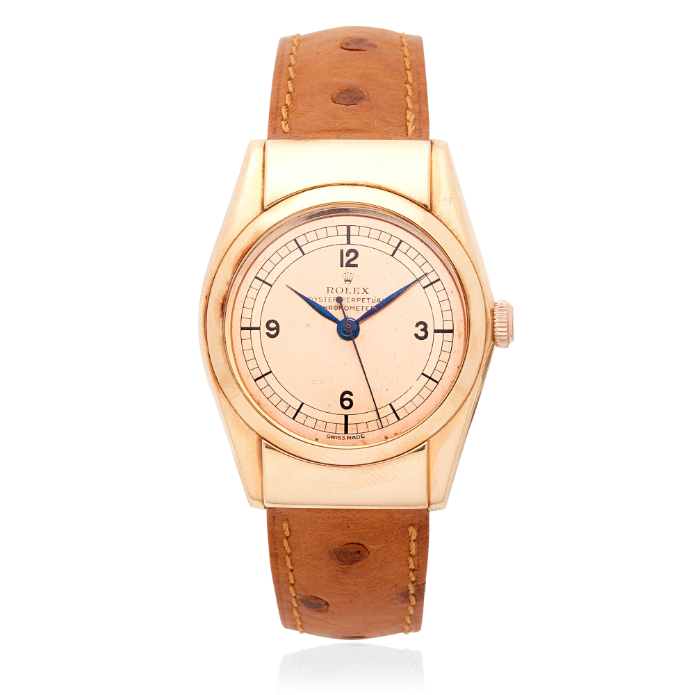 Rolex. An 18K rose gold automatic bubble back wristwatch with hooded lugs