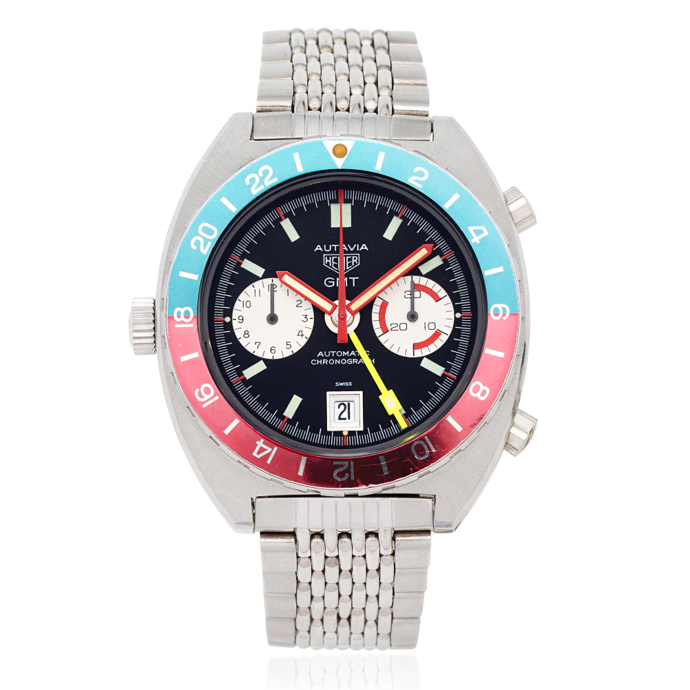 Heuer. A stainless steel automatic calendar bracelet watch with dual time zone