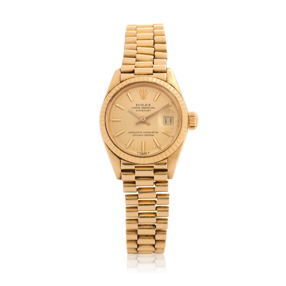 Rolex. A lady's 18K gold automatic calendar bracelet watch