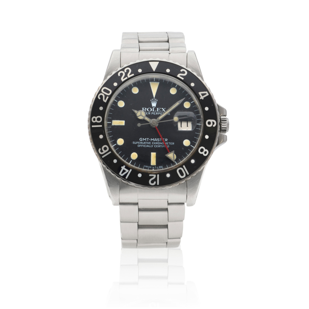 Rolex. A stainless steel automatic calendar bracelet watch with dual time zone