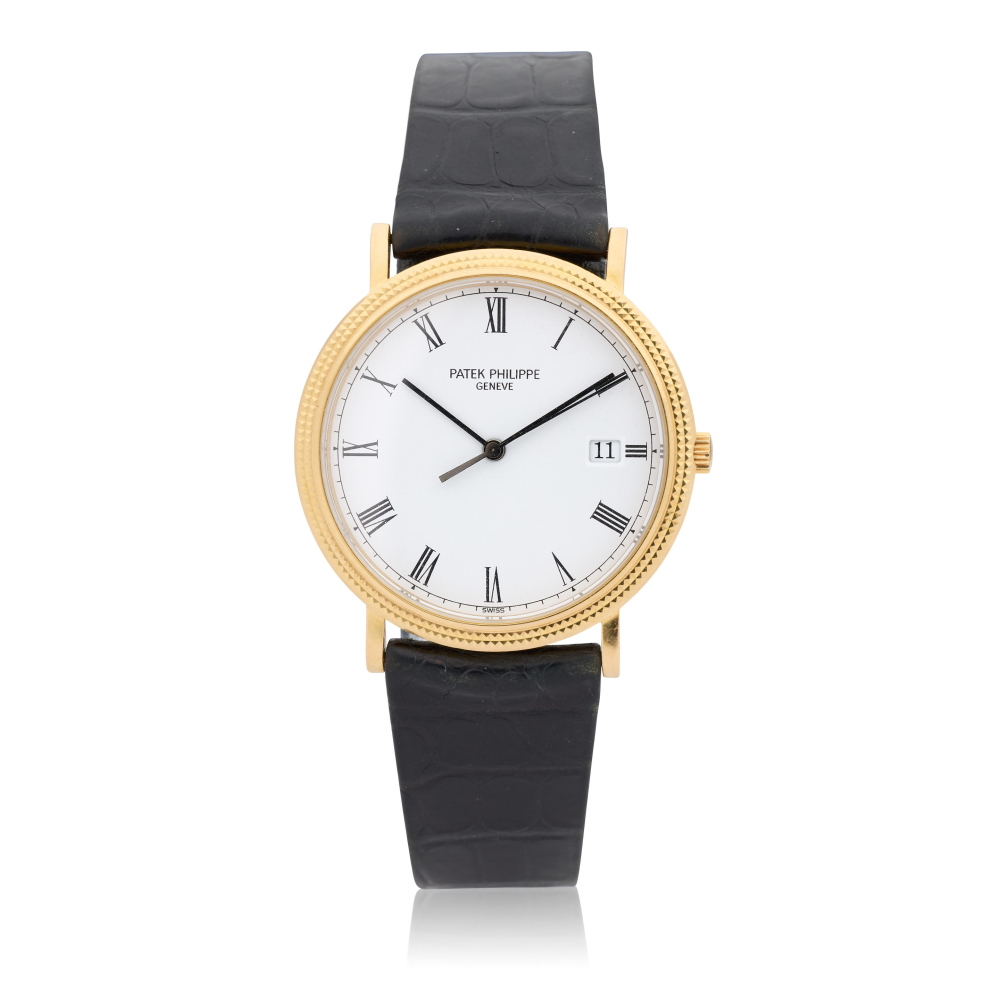 Patek Philippe. An 18K gold quartz calendar wristwatch with hobnail bezel