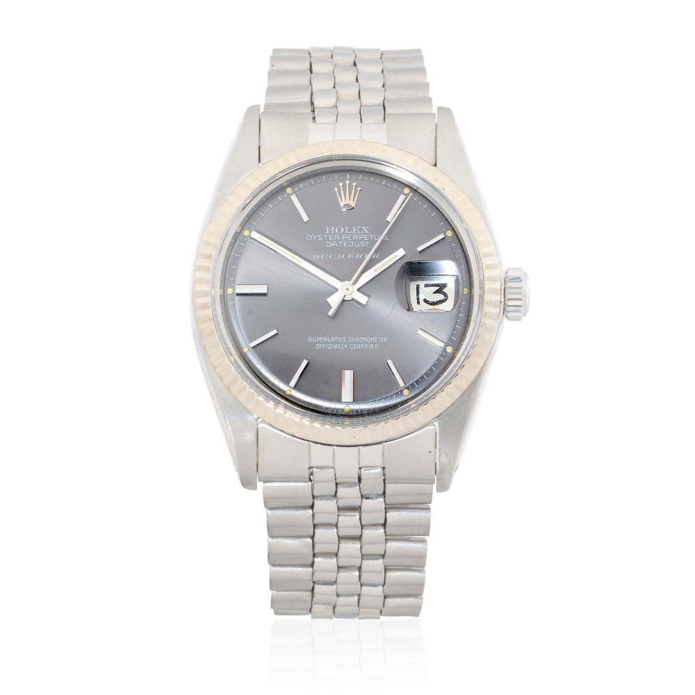 Rolex. A stainless steel and 18K white gold automatic calendar bracelet watch with sigma dial retailed by Bucherer