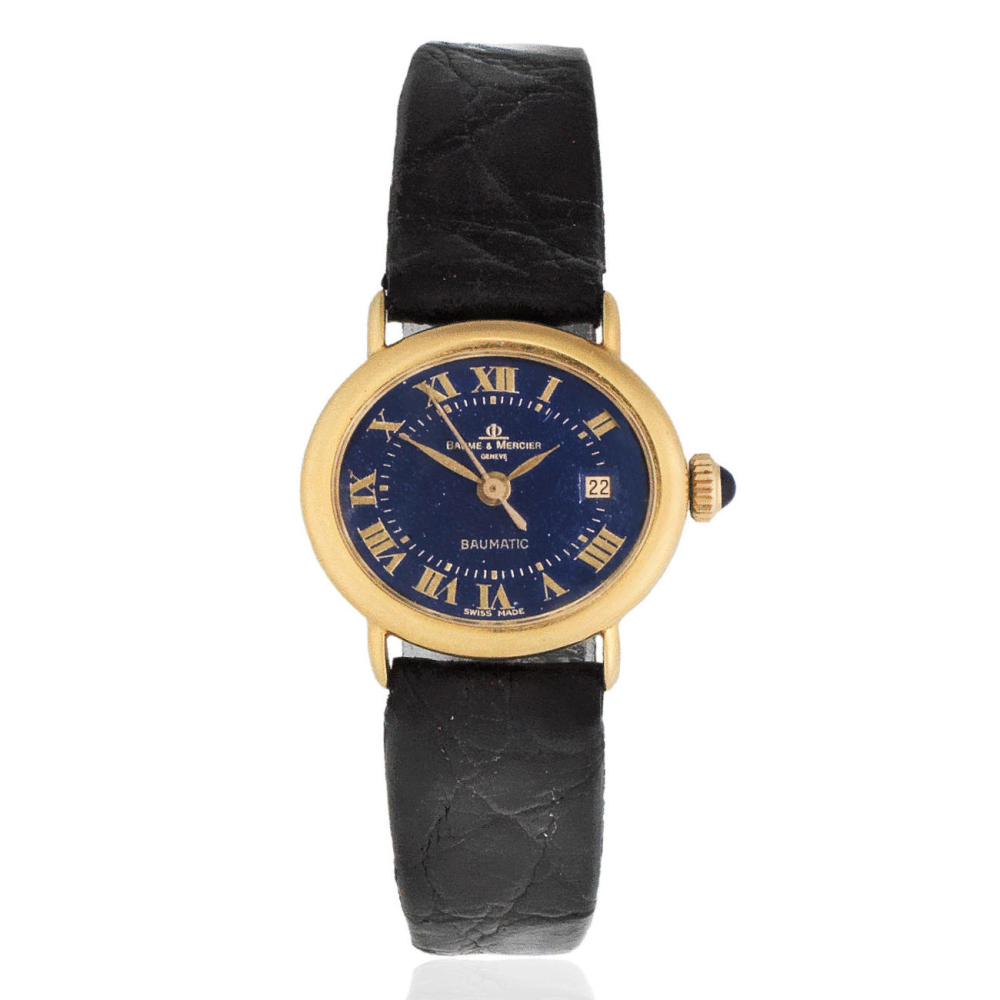 Baume & Mercier. A lady's 18K gold automatic oval calendar wristwatch