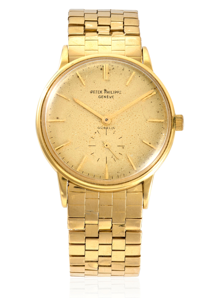 PATEK PHILIPPE RETAILED BY GÜBELIN. AN 18K GOLD MANUAL WIND BRACELET WATCH