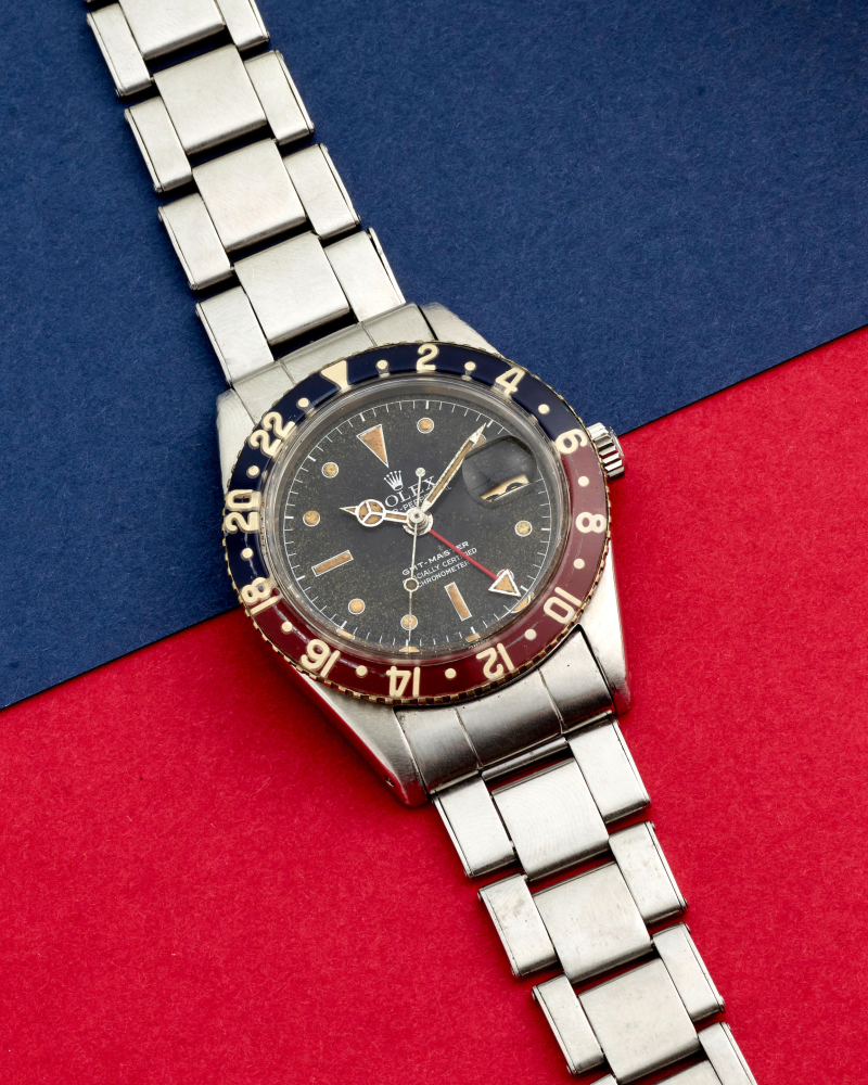 ROLEX. A FINE AND RARE STAINLESS STEEL AUTOMATIC CALENDAR BRACELET WATCH WITH DUAL TIME ZONE