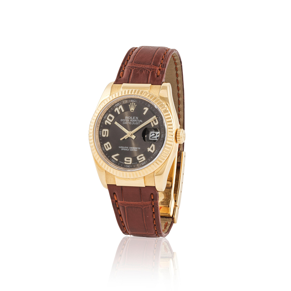 Rolex. An 18K gold automatic calendar writwatch