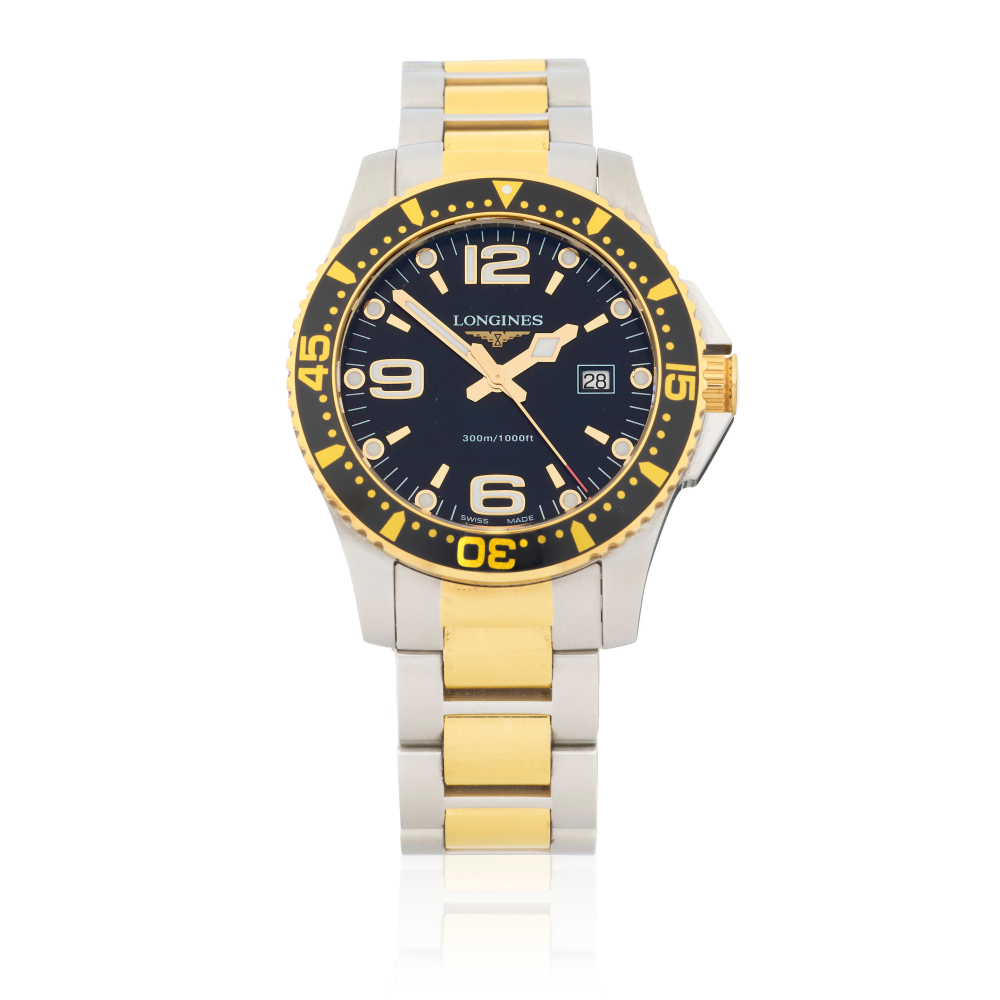 Longines. A stainless steel and gold plated quartz calendar bracelet watch