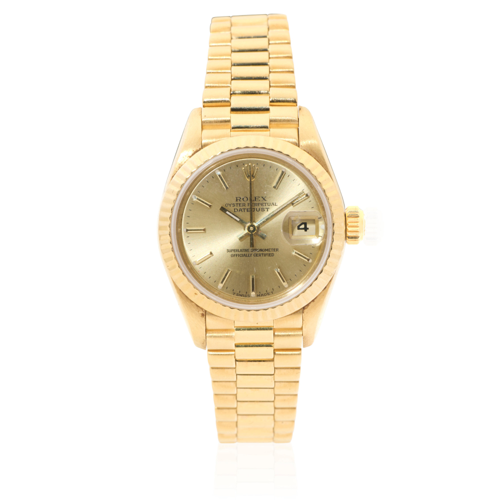 Rolex. A lady's 18K gold automatic calendar bracelet watch