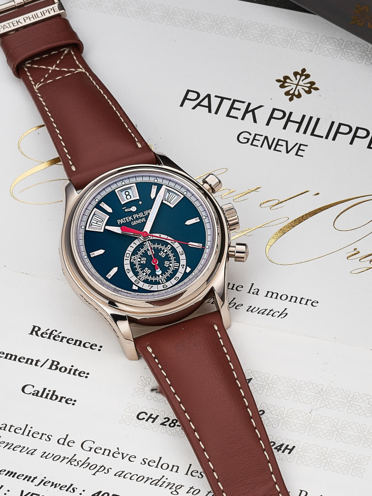 PATEK PHILIPPE | REF.5960/01G-001, A WHITE GOLD ANNUAL CALENDAR FLYBACK CHRONOGRAPH WRISTWATCH WITH POWER RESERVE AND DAY/NIGHT INDICATOR, CIRCA 2021