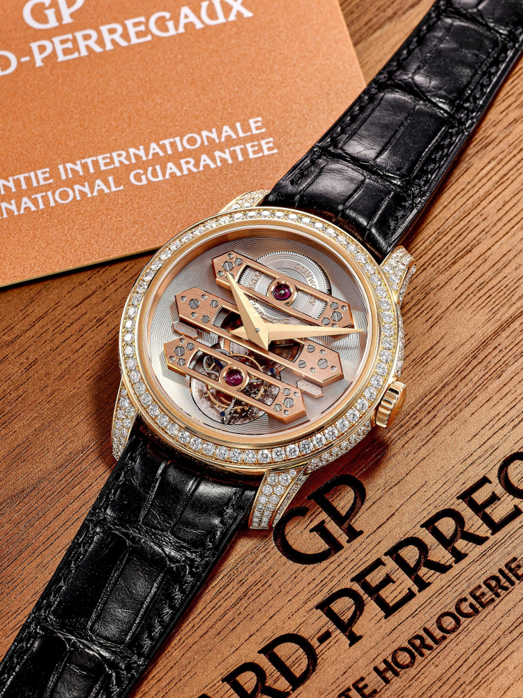 GIRARD-PERREGAUX | REF.99193, A NEW OLD STOCK PINK GOLD AND DIAMOND-SET THREE GOLD BRIDGES TOURBILLON WRISTWATCH, CIRCA 2012
