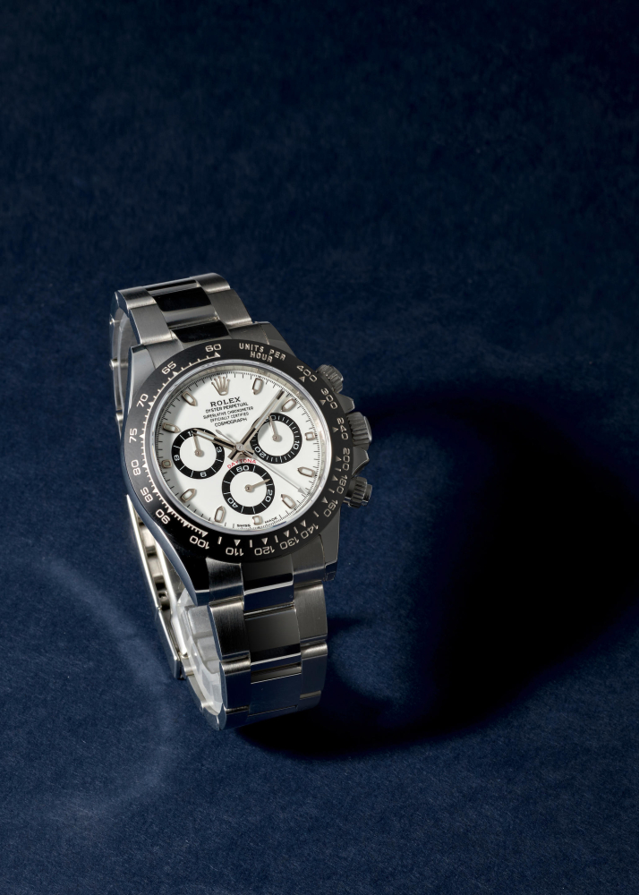ROLEX. A STAINLESS STEEL AUTOMATIC CHRONOGRAPH BRACELET WATCH