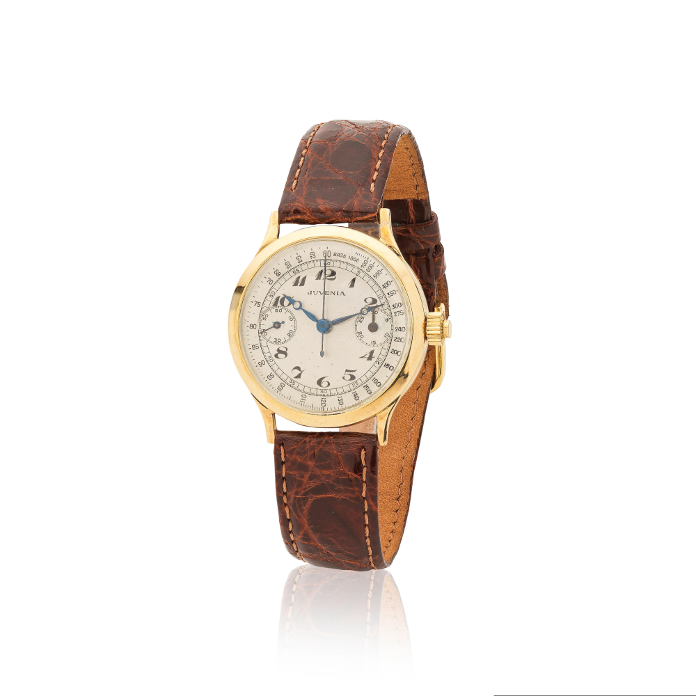 Juvenia. An 18K gold manual wind single pusher chronograph wristwatch