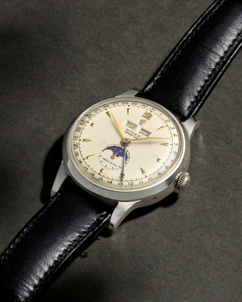 ROLEX. A STAINLESS STEEL AUTOMATIC TRIPLE CALENDAR CHRONOGRAPH WRISTWATCH WITH MOON PHASE