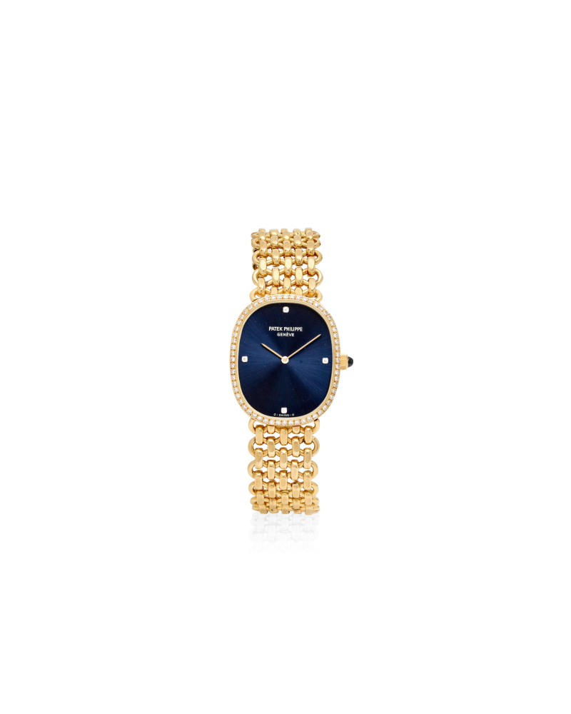 PATEK PHILIPPE. AN 18K GOLD AND DIAMOND SET MANUAL WIND BRACELET WATCH