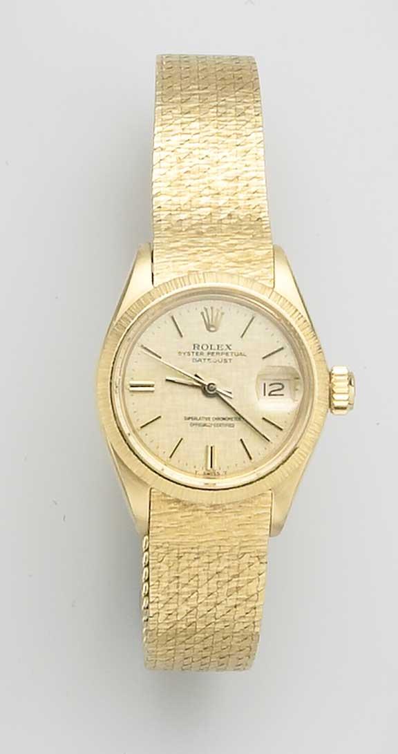 Rolex. An 18ct gold ladies bracelet watch with original box and papers