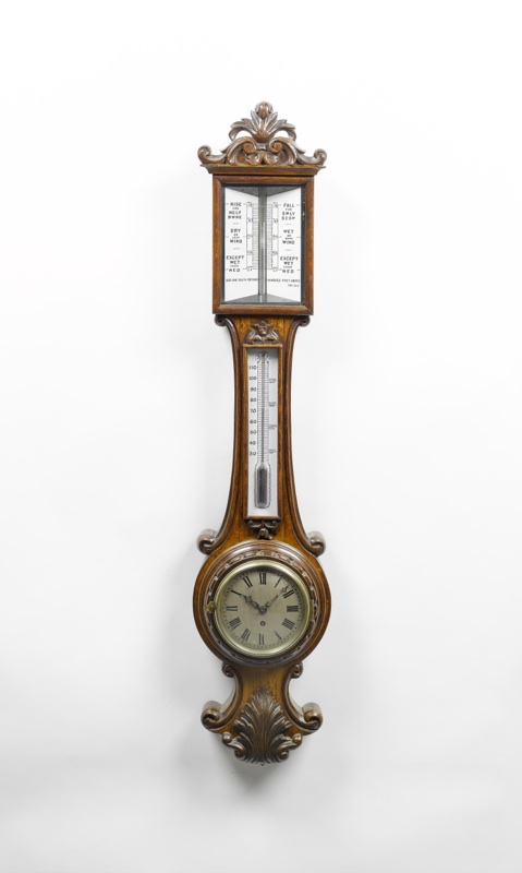A rare late 19th century combined clock and stick barometer