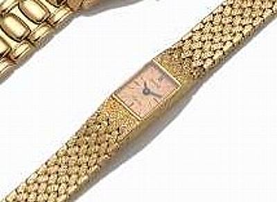 Piaget, retailed by Asprey. A Lady's 18k gold back-wind bracelet watch