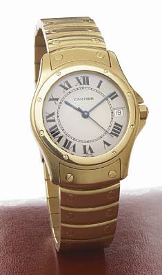 Cartier. An 18k gold self-winding calendar bracelet watch