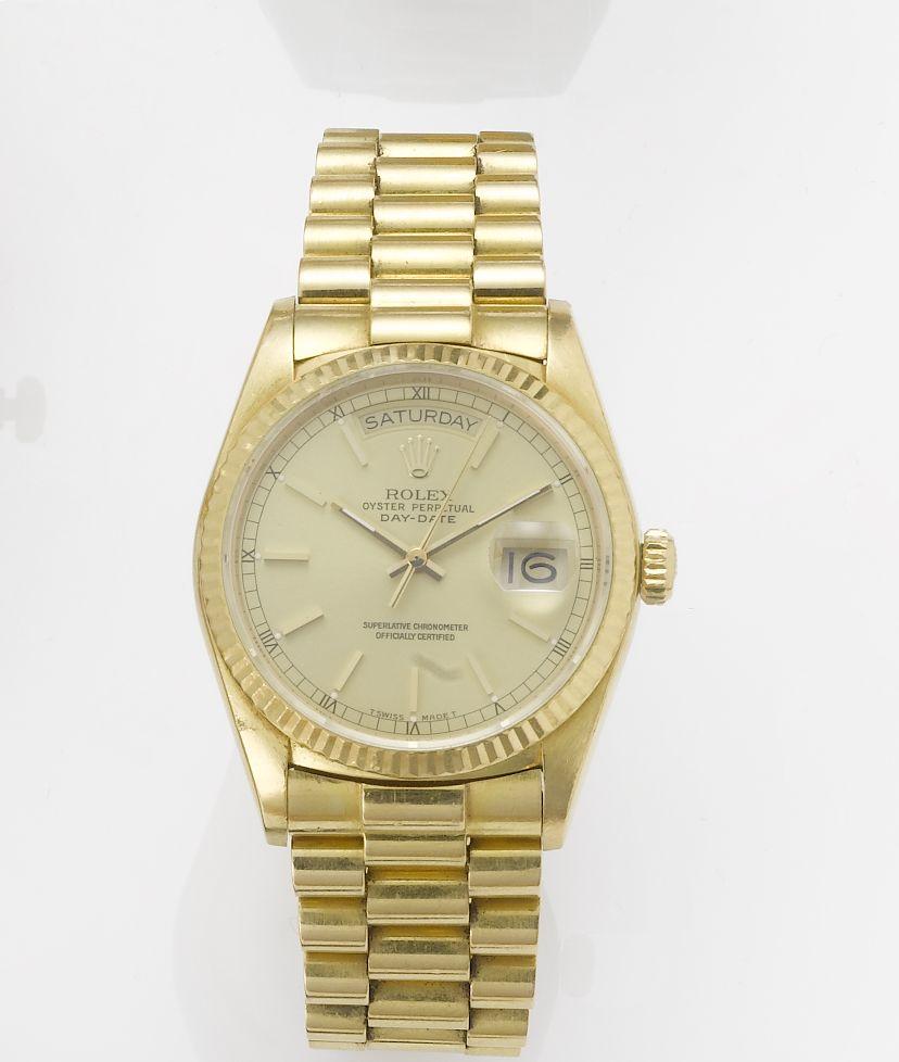 Rolex. A fine 18ct gold automatic centre seconds calendar bracelet watch together with fitted box and papers