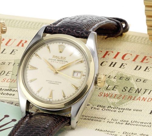 Rolex. A fine and rare stainless steel and gold, automatic centre seconds calendar wristwatch together with original chronometer & service papers