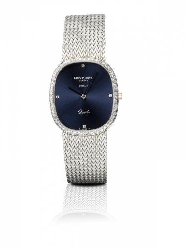 Patek Philippe. A fine 18ct white gold and diamond quartz wristwatch with bracelet