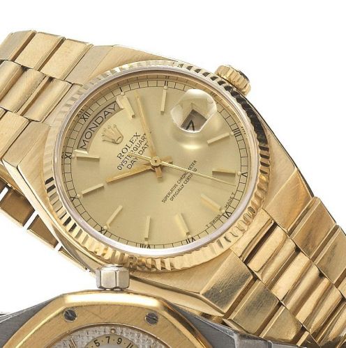 Rolex. A fine 18ct gold quartz centre seconds calendar bracelet watch