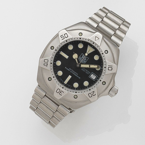 TAG Heuer. A stainless steel automatic calendar bracelet watch