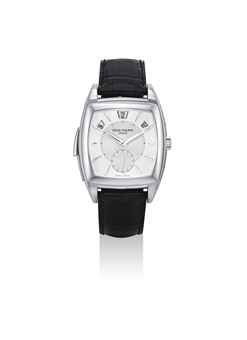 PATEK PHILIPPE. A VERY FINE AND RARE PLATINUM TONNEAU-SHAPED AUTOMATIC MINUTE REPEATING ANNUAL CALENDAR WRISTWATCH WITH ORIGINAL CERTIFICATE, BOX AND ADDITIONAL CASE BACK