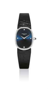 PATEK PHILIPPE. A FINE LADY'S 18K WHITE GOLD AND DIAMOND-SET CUSHION-SHAPED WRISTWATCH