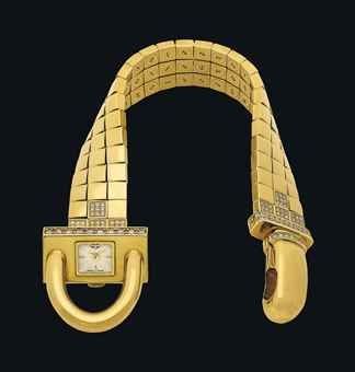 VAN CLEEF & ARPELS. A VERY FINE AND ATTRACTIVE 18K GOLD AND DIAMOND-SET CADENAS-SHAPED BRACELET WATCH