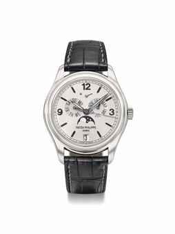 Patek Philippe. An attractive and very rare 18K white gold limited edition automatic annual calendar wristwatch with sweep centre seconds, silicon escape wheel, power reserve indication, moon phases, original certificate and box