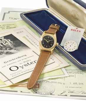 Rolex. A rare 18K gold and stainless steel automatic bubble back wristwatch with sweep centre seconds, black dial, original Guarantee, Bulletin de Marche and additional dial