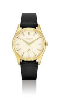 PATEK PHILIPPE. A FINE AND RARE 18K GOLD AUTOMATIC WRISTWATCH WITH ENAMEL DIAL