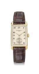 Patek Philippe. A fine and rare 18K gold rectangular curved wristwatch with Breguet numerals