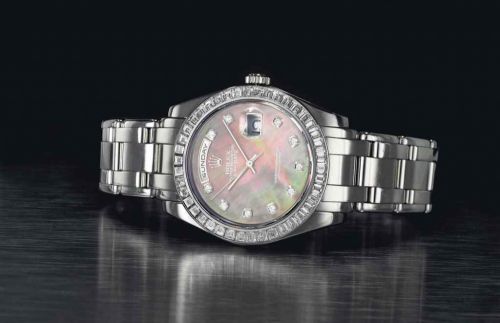 ROLEX. AN EXTREMELY FINE AND HEAVY PLATINUM AND DIAMOND-SET AUTOMATIC WRISTWATCH WITH SWEEP CENTRE SECONDS, DAY, DATE, MOTHER-OF-PEARL DIAL AND BRACELET